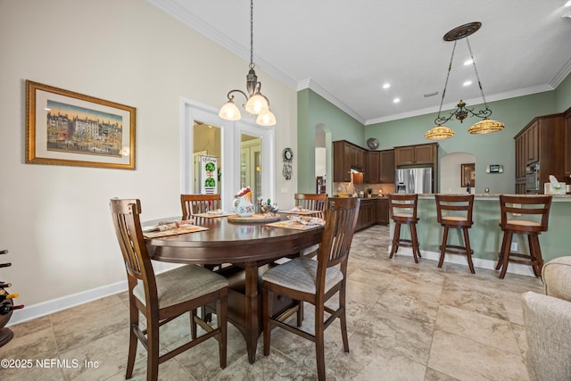 641 Donald Ross Way, Saint Augustine, FL 32092 - dining area with arched walkways, crown molding, and recessed lighting