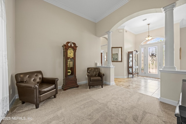 641 Donald Ross Way, Saint Augustine, FL 32092 - sitting room featuring carpet floors, decorative columns, crown molding, arched walkways, and a towering ceiling