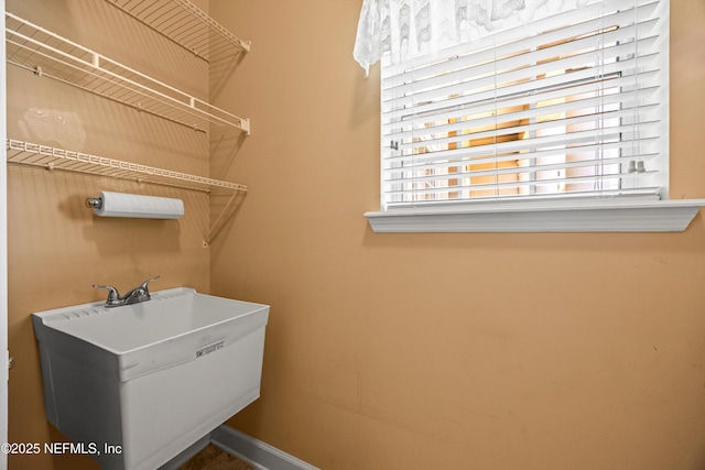 641 Donald Ross Way, Saint Augustine, FL 32092 - laundry room with a sink and baseboards