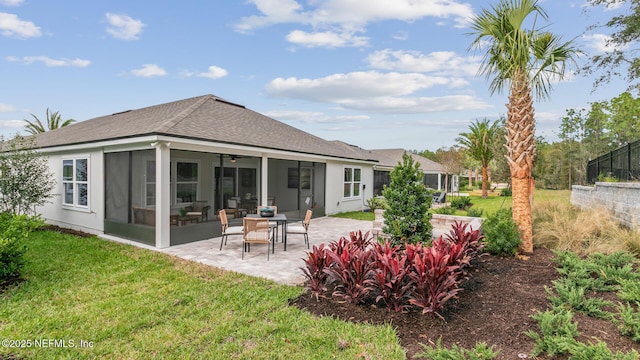 71 Green Cir, Palm Coast, FL 32164 - rear view of property featuring a sunroom, a yard, a patio area, and a shingled roof