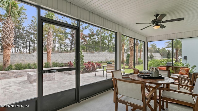 71 Green Cir, Palm Coast, FL 32164 - sunroom featuring ceiling fan, healthy amount of natural light, and outdoor dining space