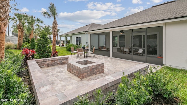 71 Green Cir, Palm Coast, FL 32164 - view of patio / terrace with a fire pit, a sunroom, and ceiling fan