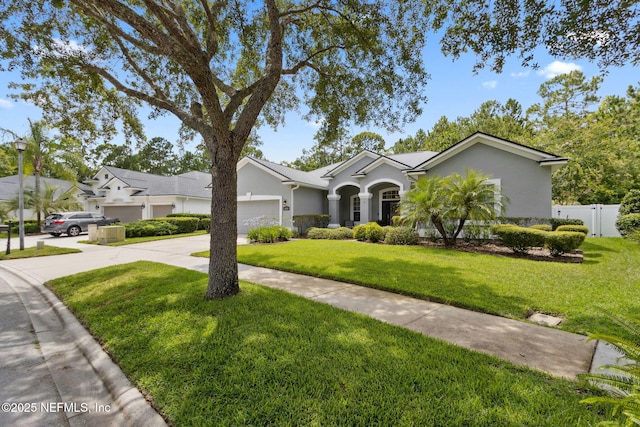 14220 Palmetto Springs St, Jacksonville, FL 32258 - single story home with an attached garage, stucco siding, and driveway