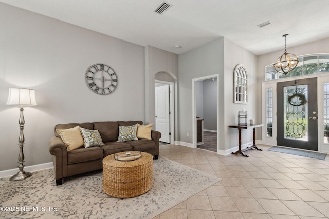 14220 Palmetto Springs St, Jacksonville, FL 32258 - tiled living room with a chandelier and arched walkways