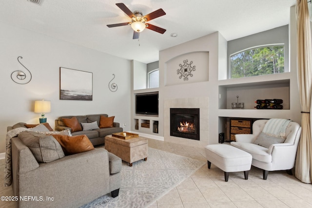 14220 Palmetto Springs St, Jacksonville, FL 32258 - living room with built in shelves, healthy amount of natural light, ceiling fan, and light tile patterned floors