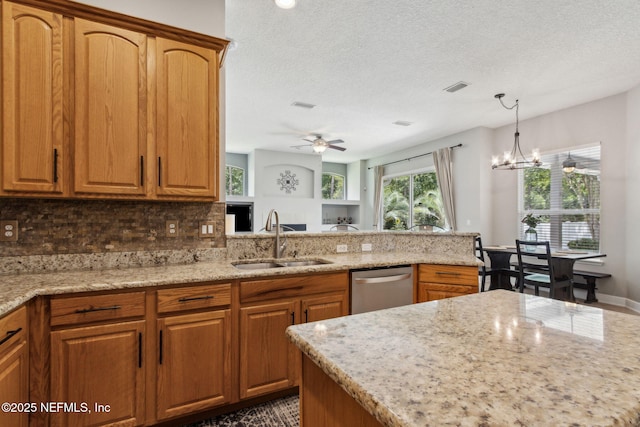 14220 Palmetto Springs St, Jacksonville, FL 32258 - kitchen featuring dishwasher, ceiling fan, backsplash, light stone countertops, and a textured ceiling