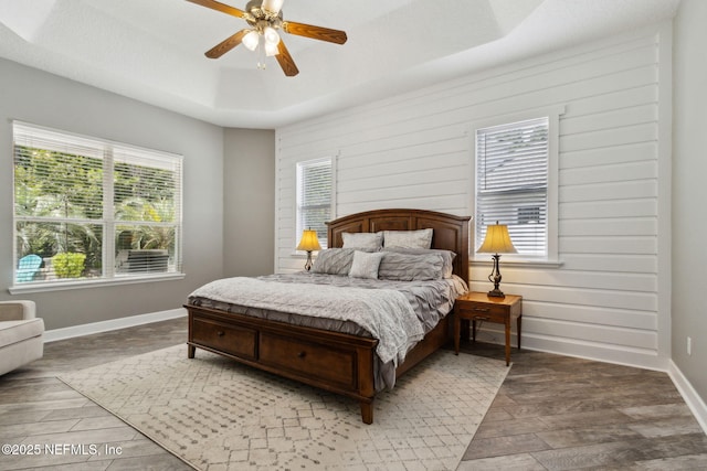 14220 Palmetto Springs St, Jacksonville, FL 32258 - bedroom with light wood-type flooring, a raised ceiling, and a ceiling fan