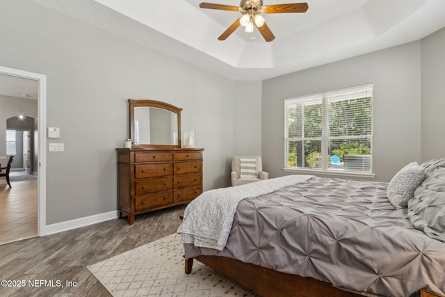 14220 Palmetto Springs St, Jacksonville, FL 32258 - bedroom featuring a raised ceiling, wood finished floors, arched walkways, and a ceiling fan