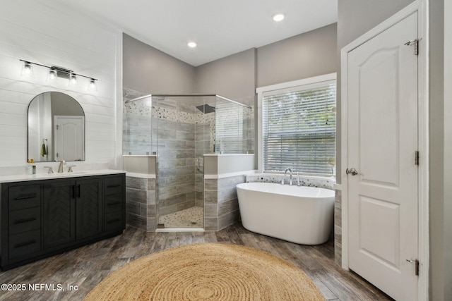 14220 Palmetto Springs St, Jacksonville, FL 32258 - bathroom with a stall shower, vanity, a soaking tub, wood finished floors, and recessed lighting