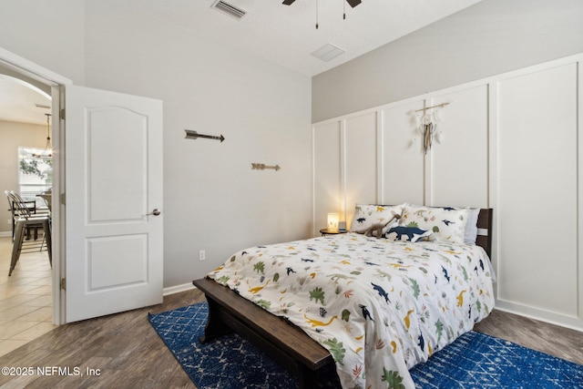 14220 Palmetto Springs St, Jacksonville, FL 32258 - bedroom with light wood finished floors, arched walkways, and a ceiling fan