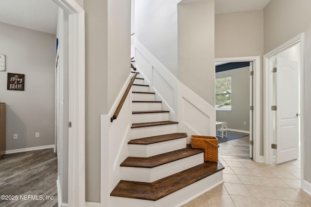 14220 Palmetto Springs St, Jacksonville, FL 32258 - staircase with baseboards and tile patterned floors