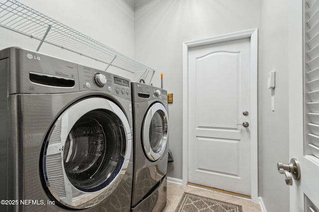 14220 Palmetto Springs St, Jacksonville, FL 32258 - laundry room featuring washing machine and dryer and light tile patterned floors