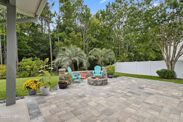14220 Palmetto Springs St, Jacksonville, FL 32258 - view of patio featuring a fire pit and view of scattered trees