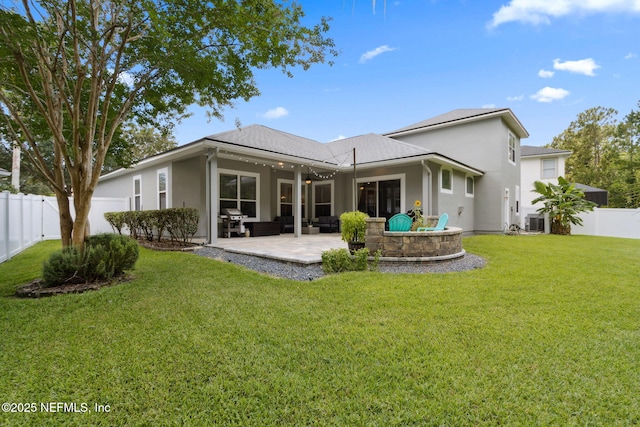 14220 Palmetto Springs St, Jacksonville, FL 32258 - rear view of house featuring a fenced backyard, a patio area, and stucco siding