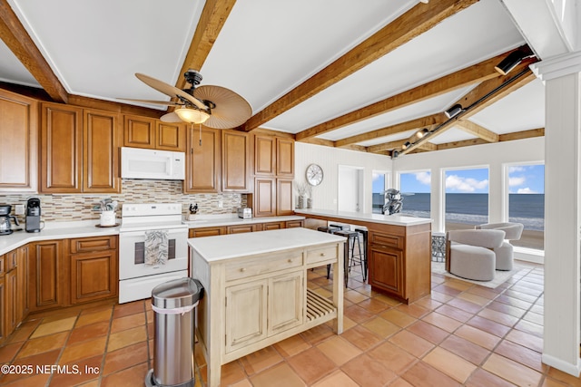 2947 S Ponte Vedra Blvd, Ponte Vedra Beach, FL 32082 - kitchen with white appliances, ceiling fan, tasteful backsplash, light countertops, and a peninsula