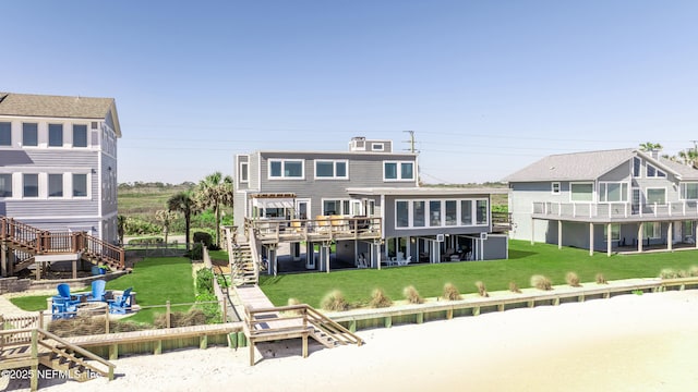 2947 S Ponte Vedra Blvd, Ponte Vedra Beach, FL 32082 - back of house with stairs, a deck, and a fenced backyard