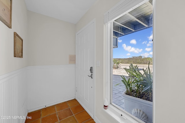 2947 S Ponte Vedra Blvd, Ponte Vedra Beach, FL 32082 - doorway to outside with wainscoting and tile patterned floors