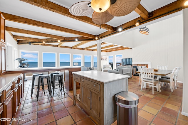 2947 S Ponte Vedra Blvd, Ponte Vedra Beach, FL 32082 - kitchen with healthy amount of natural light, beam ceiling, light countertops, a ceiling fan, and a kitchen island