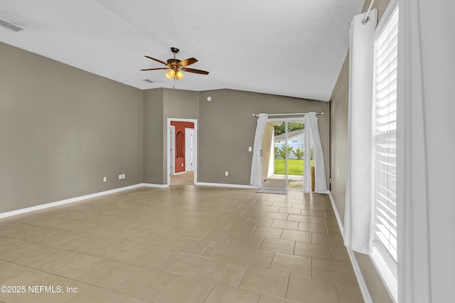 1908 Longneedle Ln, Middleburg, FL 32068 - unfurnished room featuring ceiling fan, vaulted ceiling, baseboards, a textured ceiling, and light tile patterned floors