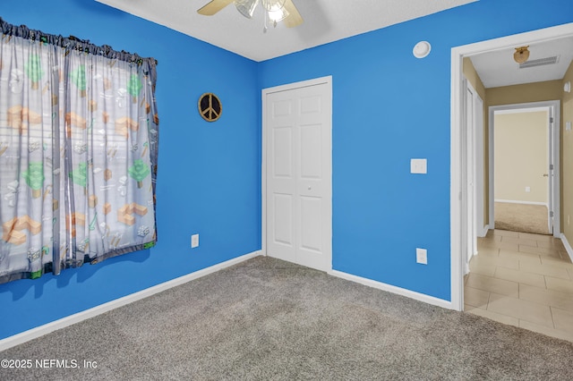 1908 Longneedle Ln, Middleburg, FL 32068 - unfurnished bedroom featuring baseboards, a closet, carpet, and a ceiling fan