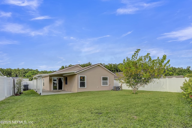 1908 Longneedle Ln, Middleburg, FL 32068 - back of property with a patio area, stucco siding, and central AC
