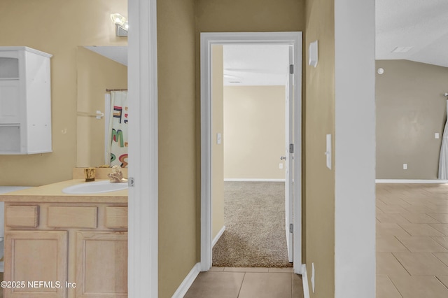 1908 Longneedle Ln, Middleburg, FL 32068 - full bath featuring tile patterned flooring, vanity, baseboards, and lofted ceiling