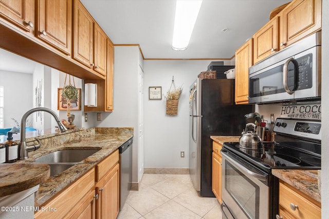 4000 Grande Vista Blvd Unit 15-206, Saint Augustine, FL 32084 - kitchen featuring appliances with stainless steel finishes, light stone countertops, and light tile patterned floors