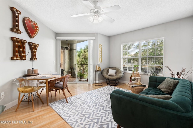 4000 Grande Vista Blvd Unit 15-206, Saint Augustine, FL 32084 - living area featuring ceiling fan, light wood-style flooring, and a textured ceiling