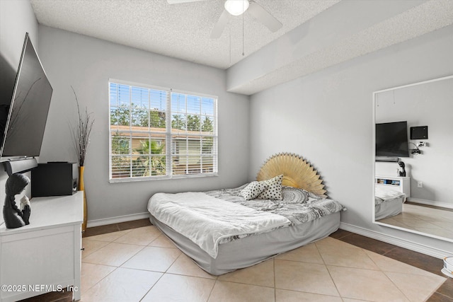 4000 Grande Vista Blvd Unit 15-206, Saint Augustine, FL 32084 - tiled bedroom featuring a textured ceiling and ceiling fan