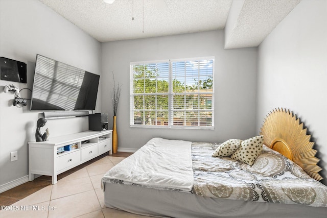 4000 Grande Vista Blvd Unit 15-206, Saint Augustine, FL 32084 - bedroom with light tile patterned flooring and a textured ceiling