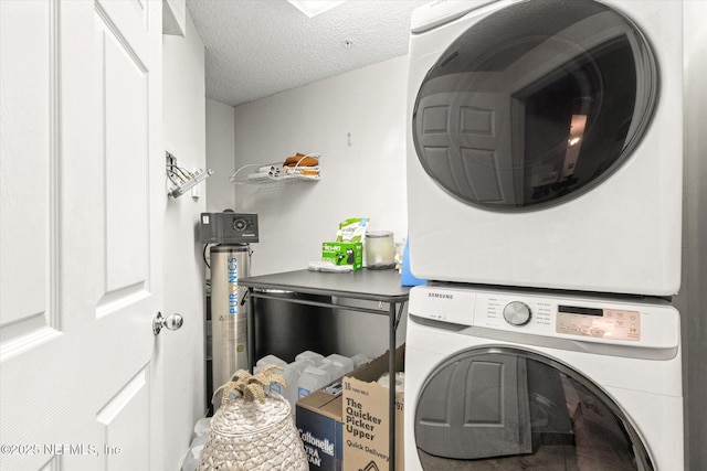 4000 Grande Vista Blvd Unit 15-206, Saint Augustine, FL 32084 - laundry area with stacked washer / drying machine and a textured ceiling