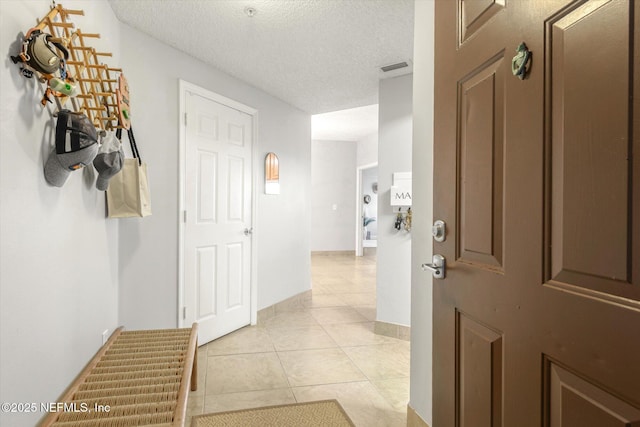 4000 Grande Vista Blvd Unit 15-206, Saint Augustine, FL 32084 - foyer entrance with light tile patterned floors and a textured ceiling
