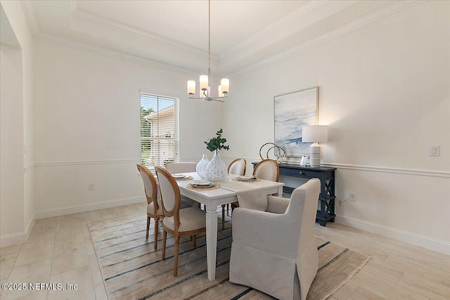 17 Derecho Ln, Saint Augustine, FL 32095 - dining room with a chandelier, crown molding, and a tray ceiling