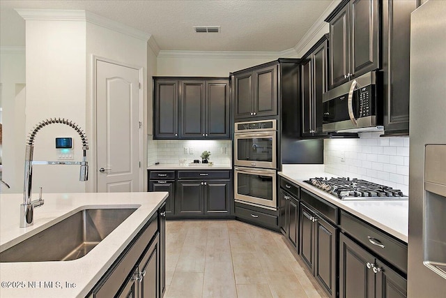 17 Derecho Ln, Saint Augustine, FL 32095 - kitchen with appliances with stainless steel finishes, light countertops, backsplash, crown molding, and a textured ceiling
