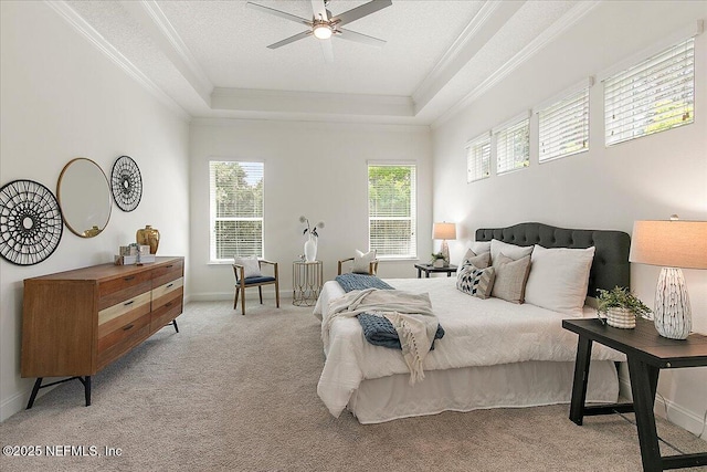 17 Derecho Ln, Saint Augustine, FL 32095 - bedroom featuring crown molding, multiple windows, carpet floors, a raised ceiling, and a ceiling fan