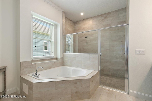 17 Derecho Ln, Saint Augustine, FL 32095 - bathroom with a jetted tub, a stall shower, and tile patterned floors
