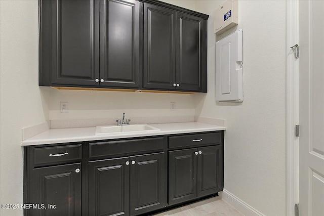 17 Derecho Ln, Saint Augustine, FL 32095 - kitchen with dark cabinetry and light countertops