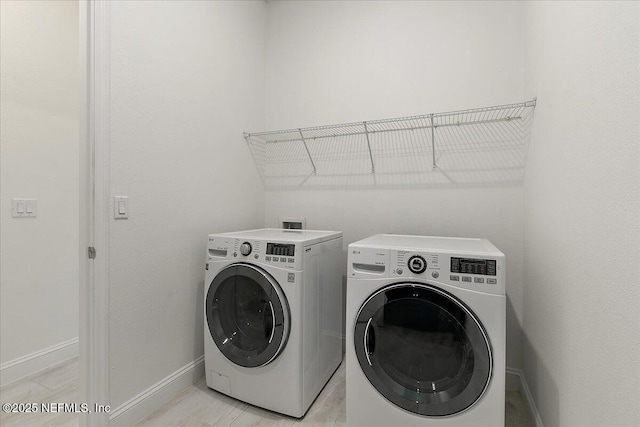 17 Derecho Ln, Saint Augustine, FL 32095 - laundry area featuring washer and dryer and baseboards