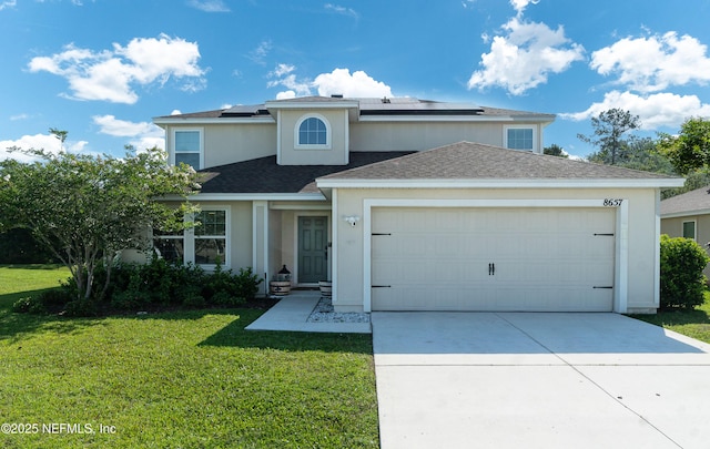 8657 Lake George Cir E, Macclenny, FL 32063 - traditional-style house with a front yard, a garage, concrete driveway, and stucco siding