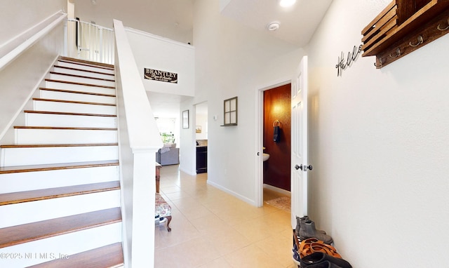 8657 Lake George Cir E, Macclenny, FL 32063 - stairway with tile patterned floors and a towering ceiling