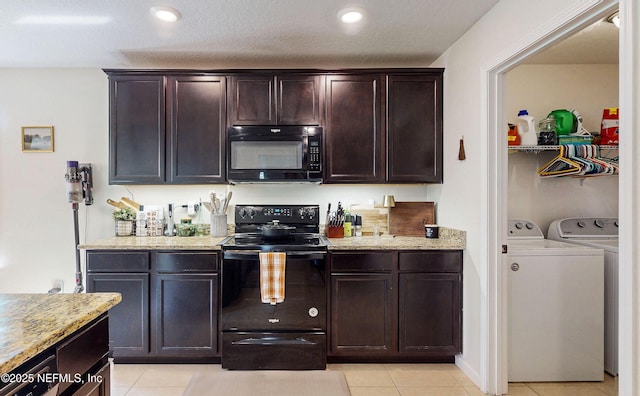 8657 Lake George Cir E, Macclenny, FL 32063 - kitchen featuring black appliances, washer and dryer, light stone countertops, dark brown cabinets, and light tile patterned flooring