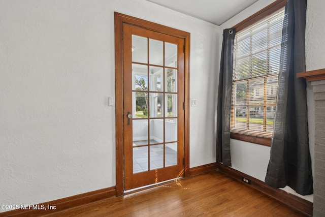 1094 Wolfe St, Jacksonville, FL 32205 - doorway with wood finished floors, healthy amount of natural light, and ornamental molding