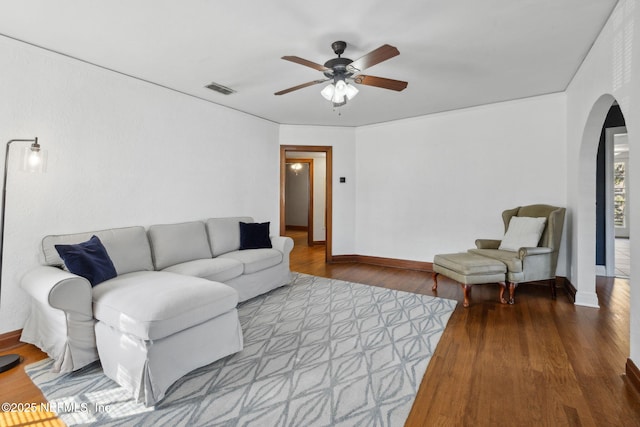1094 Wolfe St, Jacksonville, FL 32205 - living room featuring arched walkways, ceiling fan, and wood finished floors