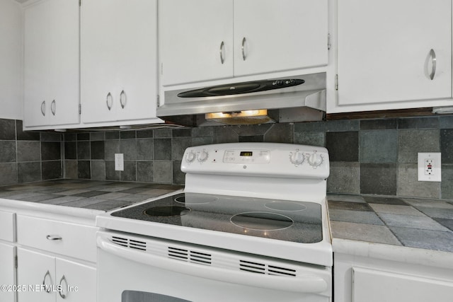 1094 Wolfe St, Jacksonville, FL 32205 - kitchen featuring white electric range oven, under cabinet range hood, white cabinets, and tasteful backsplash