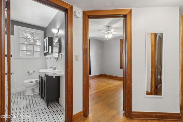 1094 Wolfe St, Jacksonville, FL 32205 - bathroom featuring vanity, a ceiling fan, and wood finished floors