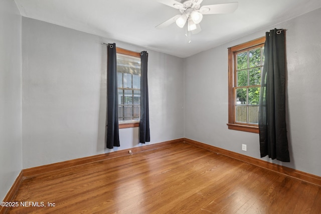 1094 Wolfe St, Jacksonville, FL 32205 - empty room with wood finished floors and a ceiling fan