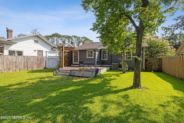 1094 Wolfe St, Jacksonville, FL 32205 - back of house featuring a fenced backyard, a deck, and a gate