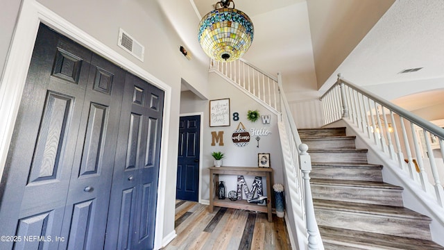 1441 Laurel Oak Dr, Fleming Island, FL 32003 - stairway with wood finished floors