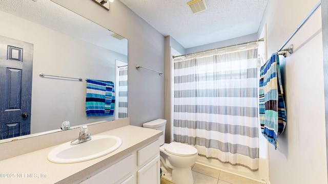1441 Laurel Oak Dr, Fleming Island, FL 32003 - full bath with a textured ceiling, vanity, tile patterned floors, and toilet
