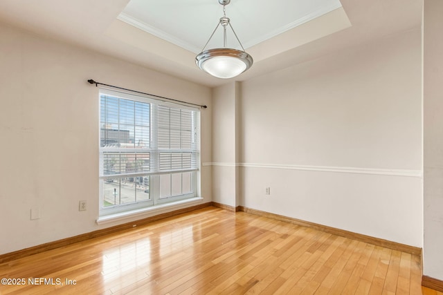 400 E Bay St Unit 401, Jacksonville, FL 32202 - unfurnished room with hardwood / wood-style floors, crown molding, and a raised ceiling